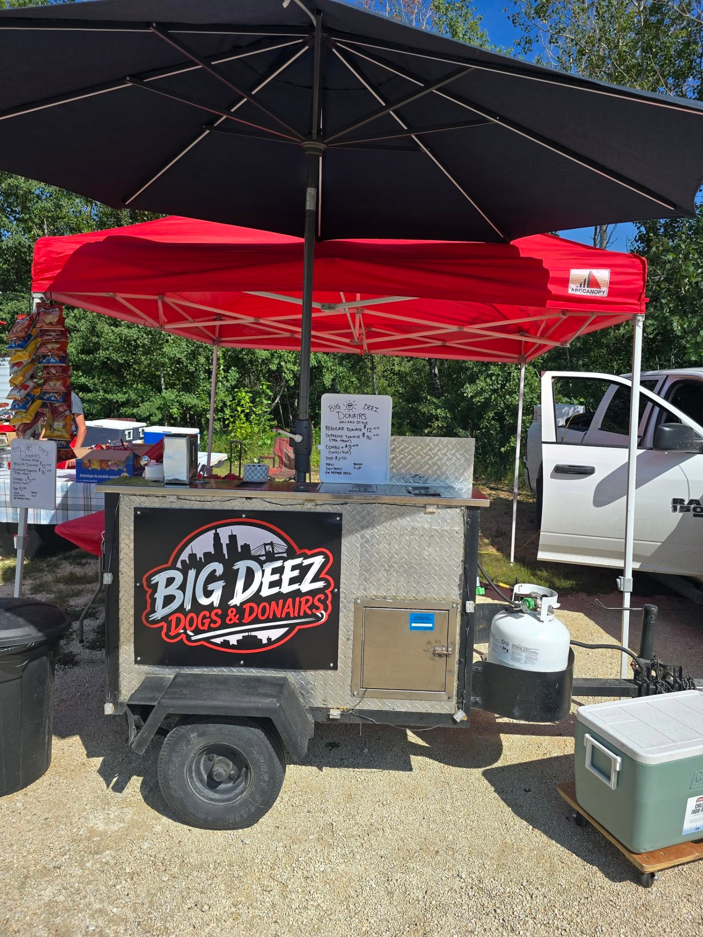 The Big Deez Dogs & Donairs food cart set up at an outdoor event