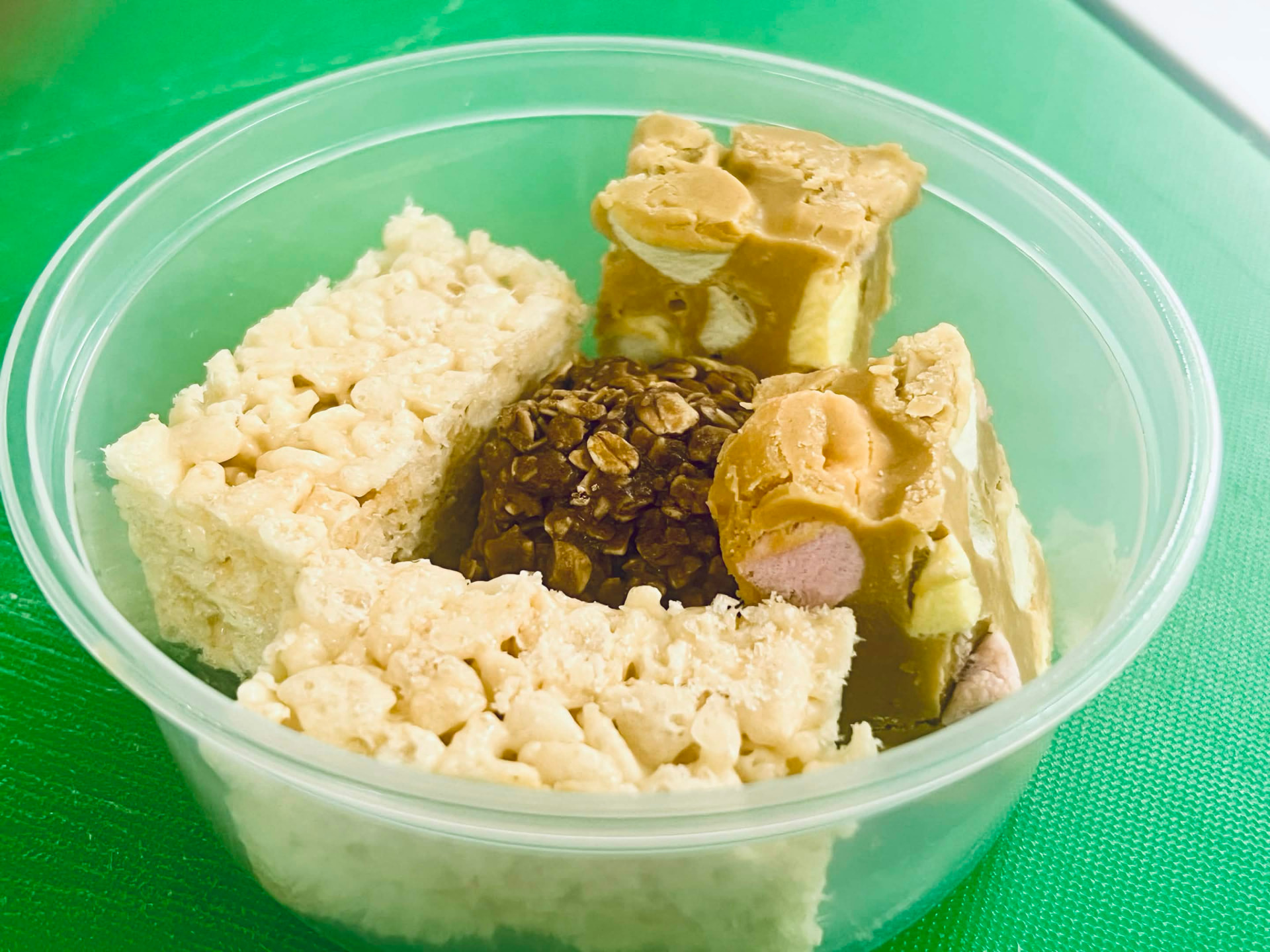 Baba's snack pack with Rice Krispie squares, peanut butter marshmallow squares and coconut oat bites
